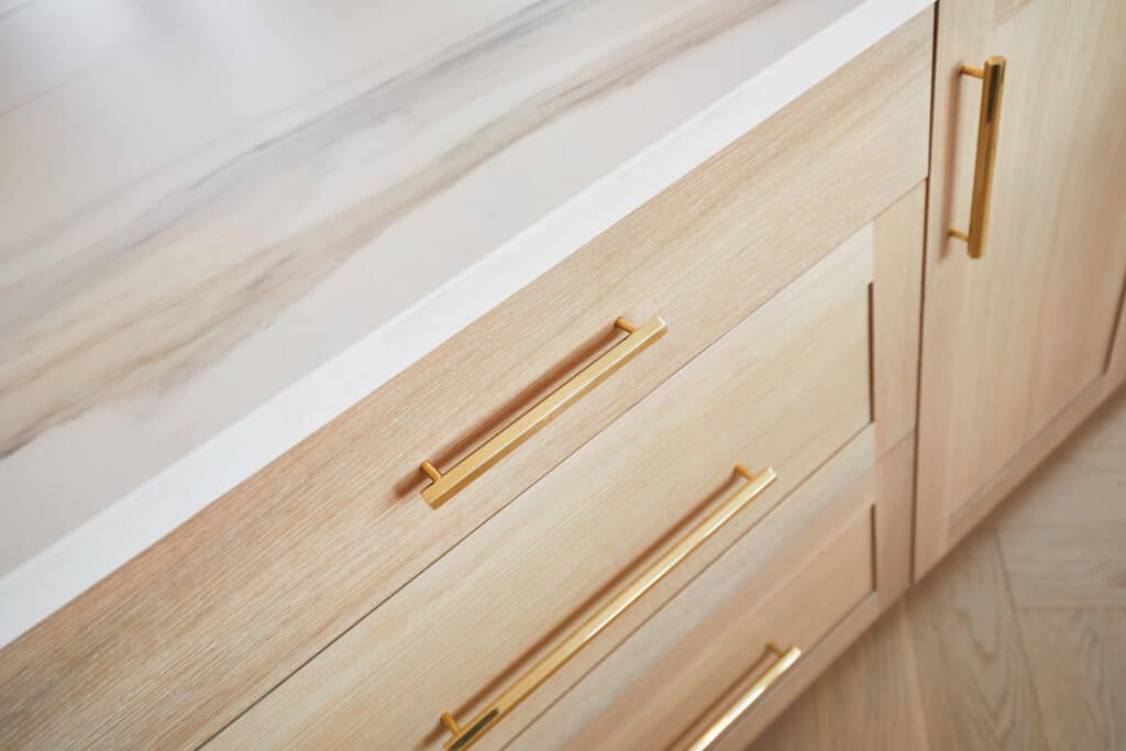 Modern Oak Cabinets with Gold Hardware Detail