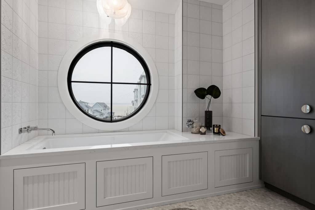 Contemporary Cottage Master Bathroom Bathtub with Round Window Above